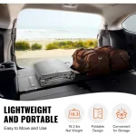 Carport canopy folded and stored in the back of a vehicle with luggage bags